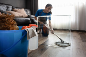 Cleaner wiping floor as part of end of tenancy cleaning Tamworth